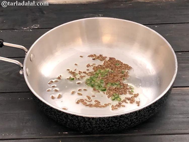 Step 17 – Add the green chillies and cook for 1 minute.