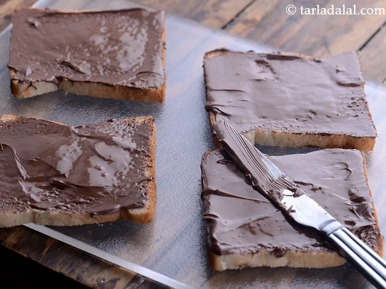 Step 3 – Spread &frac34; tbsp of nutella spread evenly on each bread slice. &nbsp;