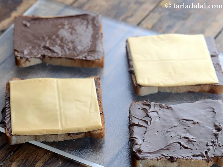 Step 4 – Place 2 cheese slices on 2 nutella spread bread slices. &nbsp;