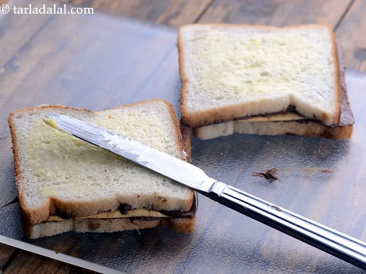 Step 6 – Brush a little melted butter on top of the bread. &nbsp;