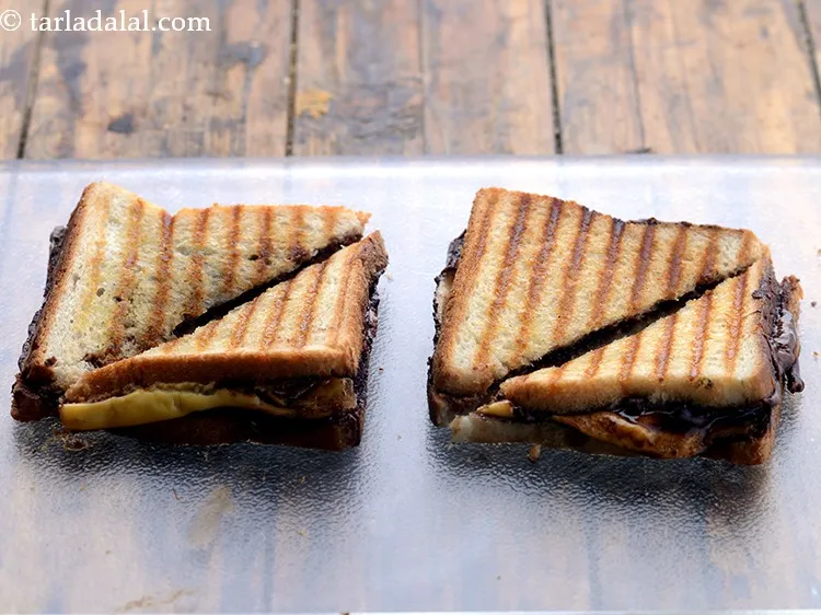 Step 8 – Cut each&nbsp;<strong>grilled chocolate cheese sandwich | cheese chocolate&nbsp;Nutella&nbsp;&nbsp;sandwich | grilled chocolate sandwich |</strong>&nbsp;diagonally into 2 …