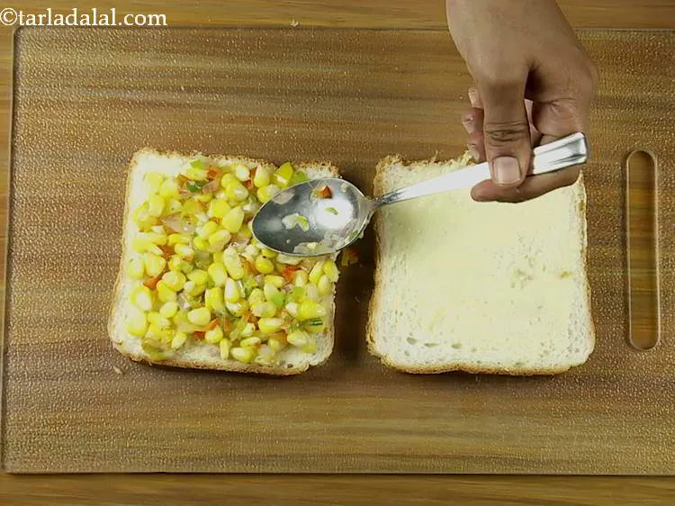 Step 14 – Spread 1/4th of the mixture evenly over it.