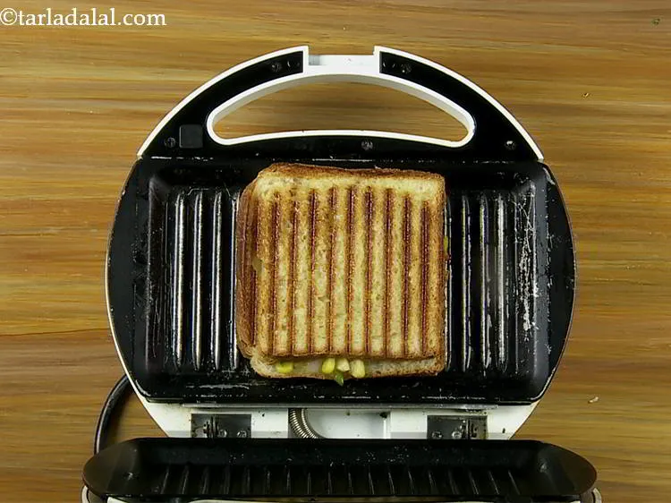 Step 18 – Place the <strong>corn and capsicum sandwich</strong> in the greased pre-heated griller and grill for 4 …