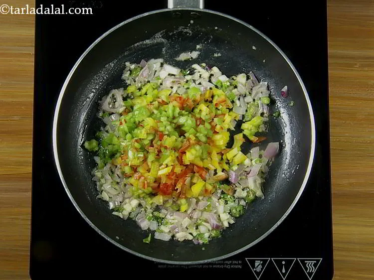 Step 7 – Add the capsicum. You can use bell pepper to make the stuffing more colorful.