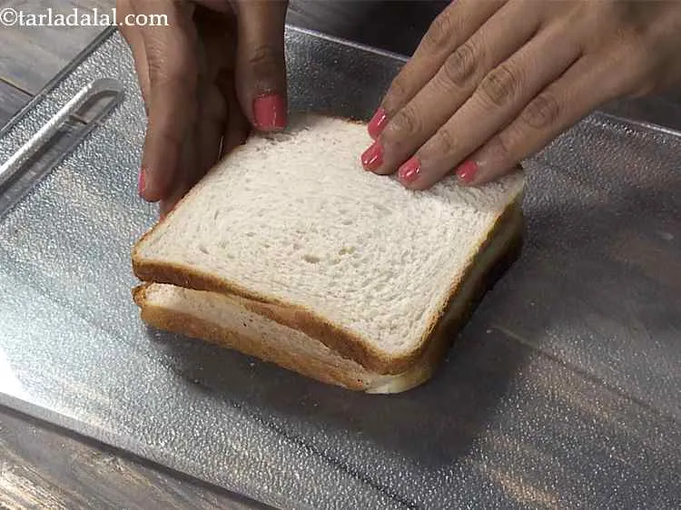 Step 9 – Finally cover the sandwich with the buttered side facing downwards.