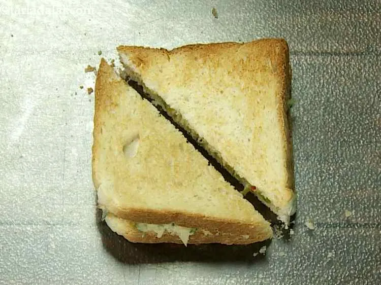 Step 20 – Cut each <strong>toasted hummus sandwich |&nbsp;veg hummus sandwich Indian style&nbsp;|&nbsp;veggie and hummus sandwich&nbsp;|&nbsp;mediterranean hummus sandwich&nbsp;|</strong> …