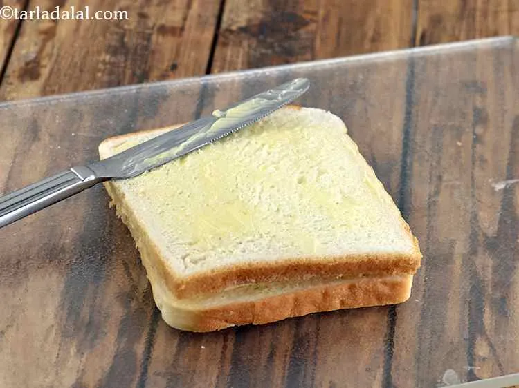 Step 11 – Apply ? tsp of butter evenly over it.