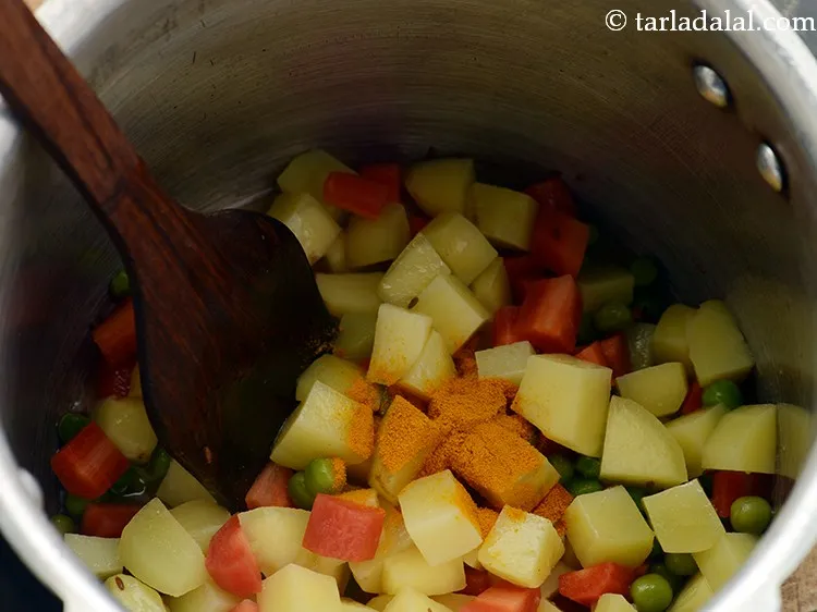 Step 14 – Add turmeric powder.