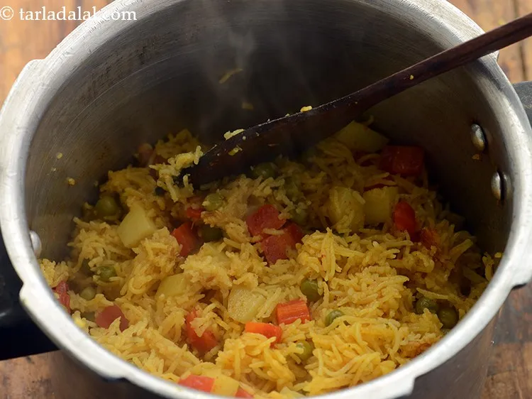 Step 22 – Mix&nbsp;<strong>Gujarati masala bhaat | khaari bhaat | quick khari bhat |&nbsp;</strong>well.