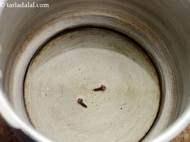 Step 6 – Once the ghee is hot and melts, add the cloves.