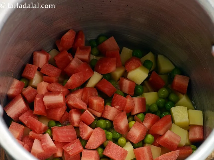 Step 12 – Add carrots. Add any veggies of your choice. Onions, tomatoes, french beans, capscium can also …