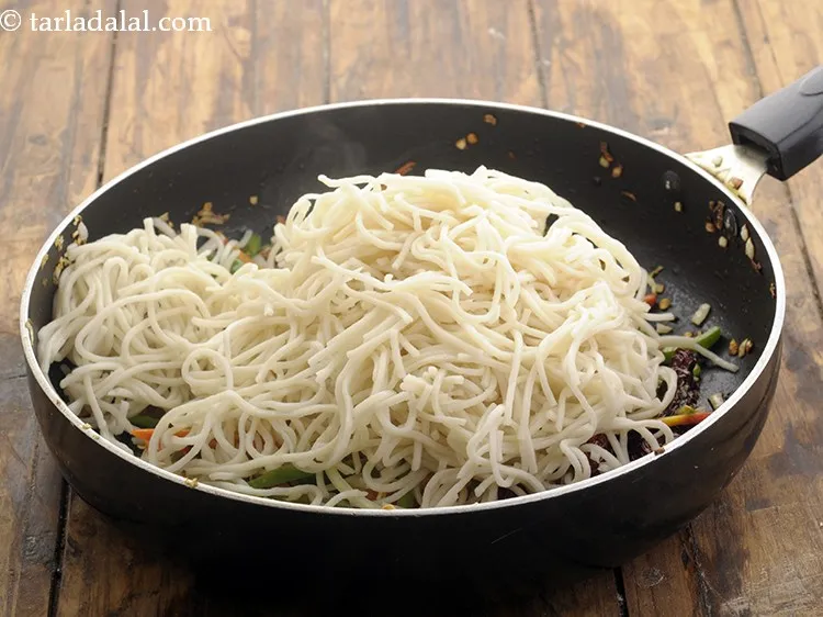 Step 12 – Add the boiled noodles. To the boiled and strained noodles always rub in some oil …