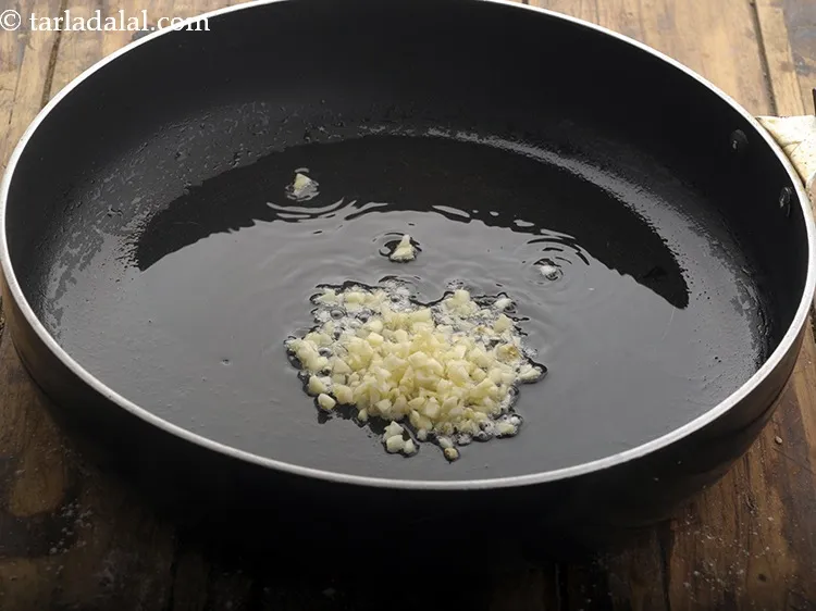 Step 8 – Add garlic which would give a unique flavour to our&nbsp;<strong>hakka noodles</strong>