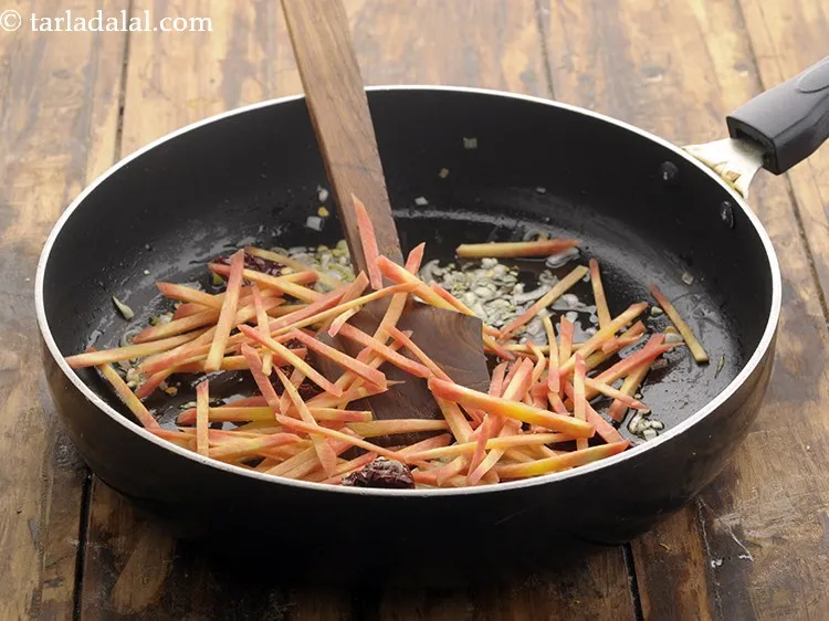 Step 9 – Then add the sliced carrots.