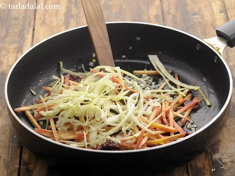 Step 10 – Add the shredded cabbage.