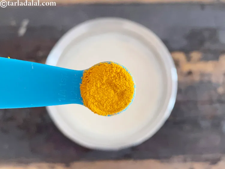 Step 6 – <meta charset="UTF-8" />Add 1/4 tsp&nbsp;<a href="glossary-turmeric-powder-haldi-645i">turmeric powder (haldi)</a>.