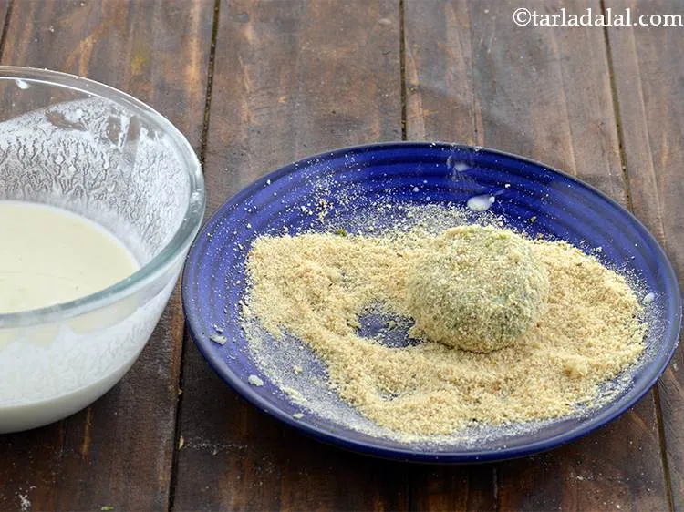 Step 28 – Put the bread crumbs in a plate and then roll the tikki in the breadcrumbs. …