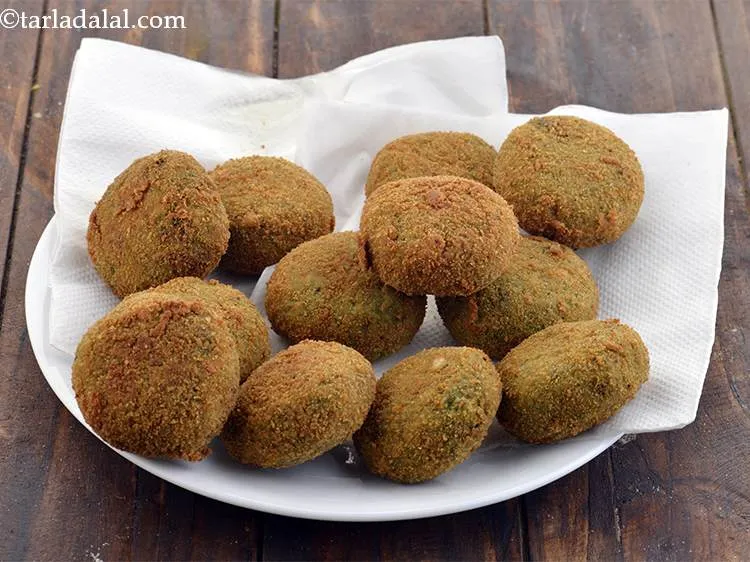 Step 29 – Heat the oil in a non-stick kadhai and deep-fry the kababs, a few at a …