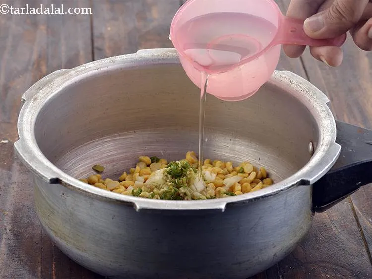 Step 5 – Then add half cup water and mix well.