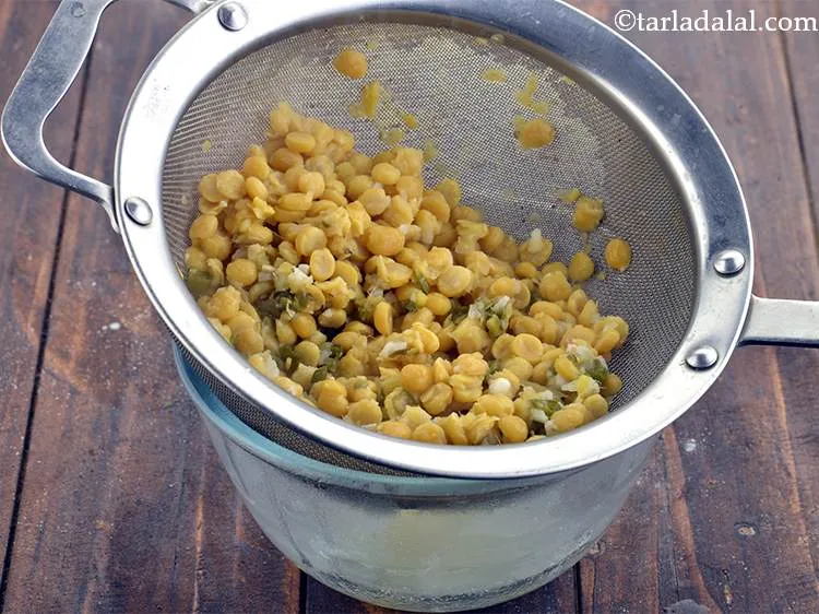 Step 13 – Using a strainer, strain the dal. This is very important because if the mixture has …