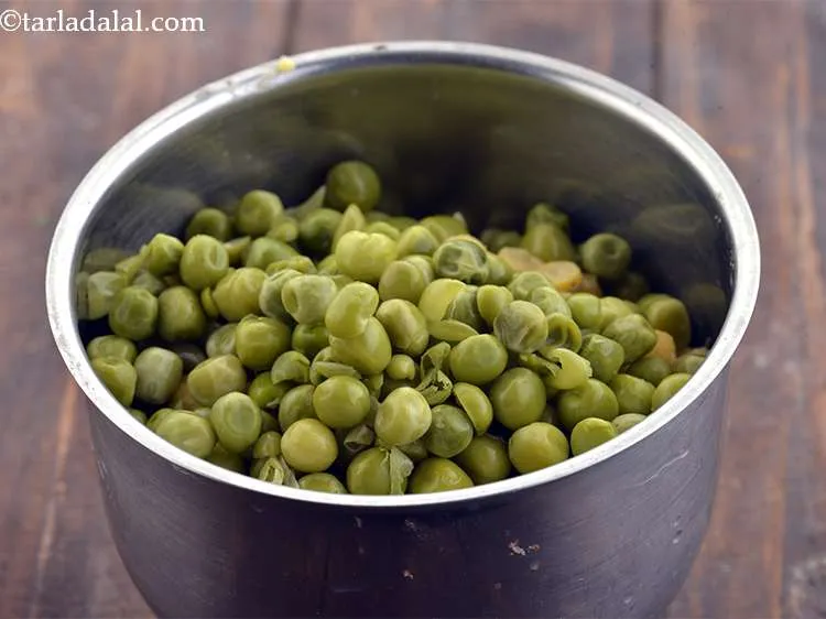 Step 9 – Now add the boiled green peas to the mixer jar. These can be boiled on …