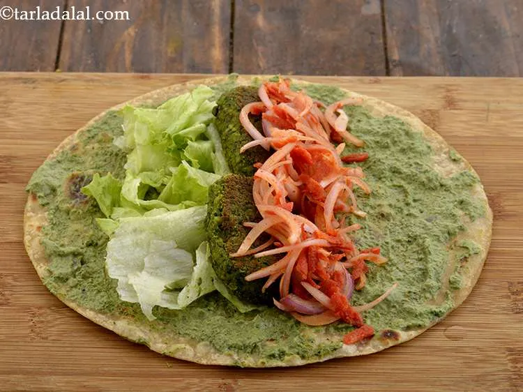 Step 41 – Arrange &frac14; th of the carrot-onion mixture over it.