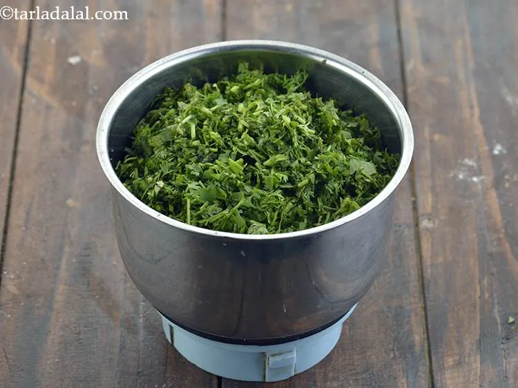 Step 26 – Also add cleaned, washed and roughly chopped coriander to the mixer. We have used &frac12; …