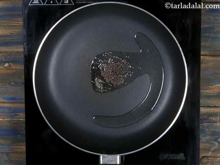 Step 9 – Once the oil is hot, add the mustard seeds.