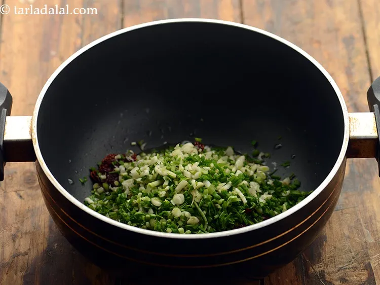 Step 14 – Add green garlic. Green garlic is young, slightly milder garlic then the regular one. Just …