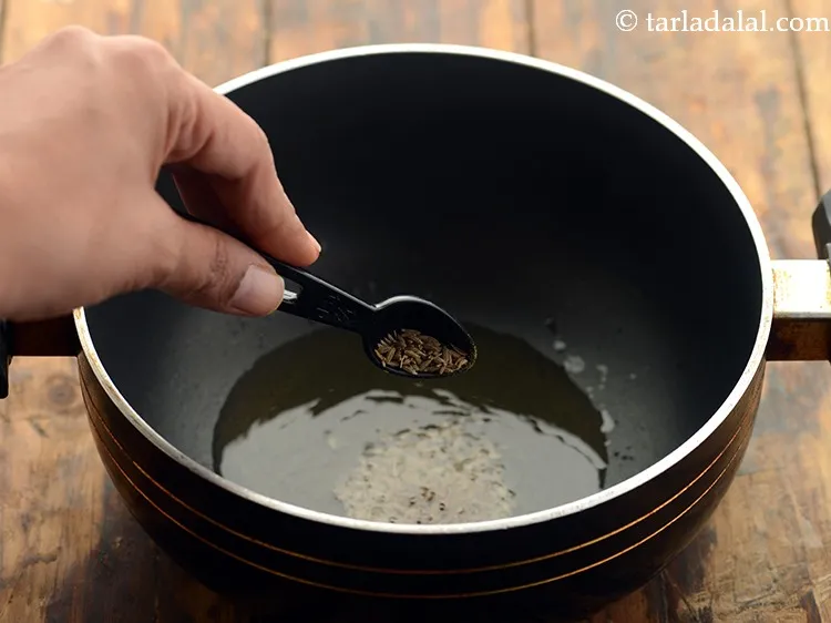 Step 11 – Once the oil is hot, add the cumin seeds.