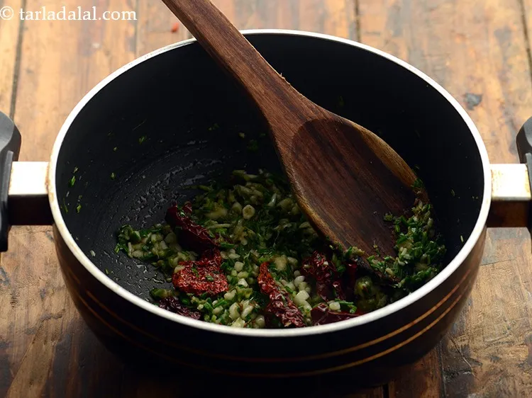 Step 16 – Add asafoetida to counter the gassy effects of the arhar dal and saut&eacute; on a …