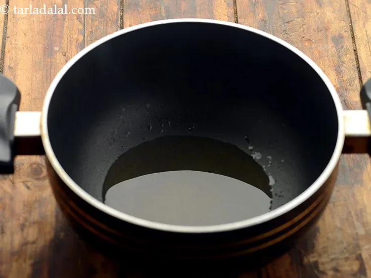 Step 10 – To temper <strong>green garlic dal</strong>, heat the oil in a deep non-stick pan. Ghee can …