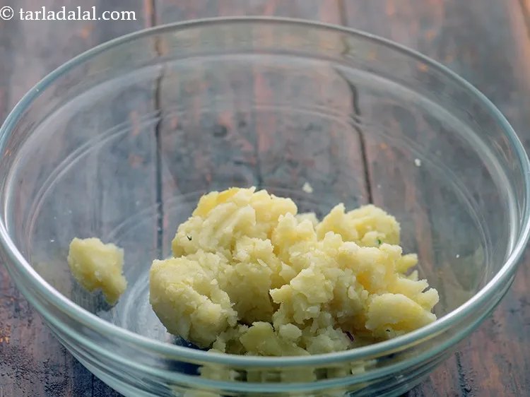 Step 20 – To prepare <strong>spinach koftas for Hariyali kofta</strong>, in a deep bowl take boiled, peeled and …