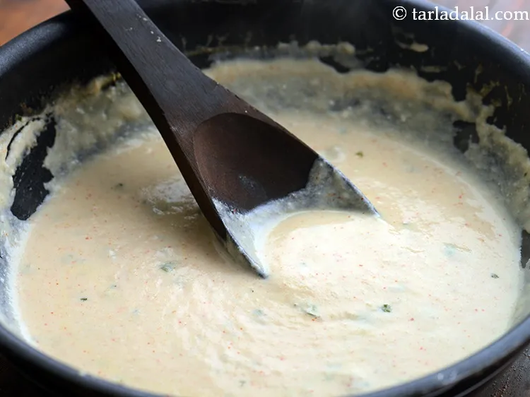 Step 46 – Mix well and cook on a medium flame for 1 minute. After adding cream do …