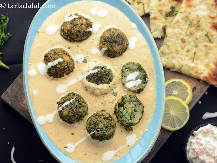 Step 48 – Mix gently and simmer for 1 to 2 minutes. Our <strong>palak kofta</strong> curry is ready.&nbsp;Garnish …