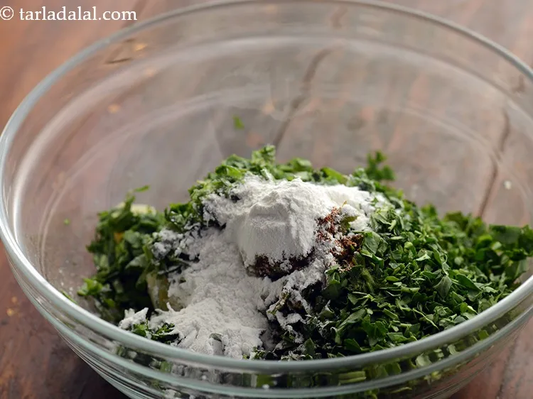 Step 26 – Add 2 tbsp of cornflour to give a crispy texture to the spinach koftas.