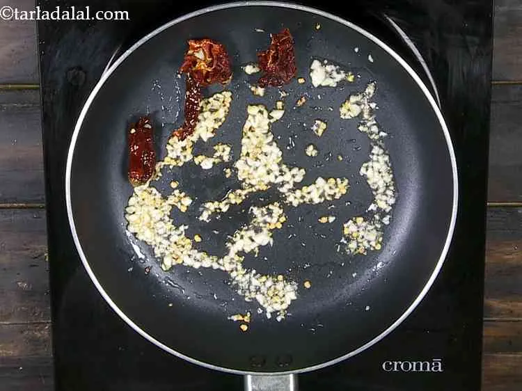 Step 11 – Add the dry red chillies and saut? on a medium flame for 30 seconds. They …