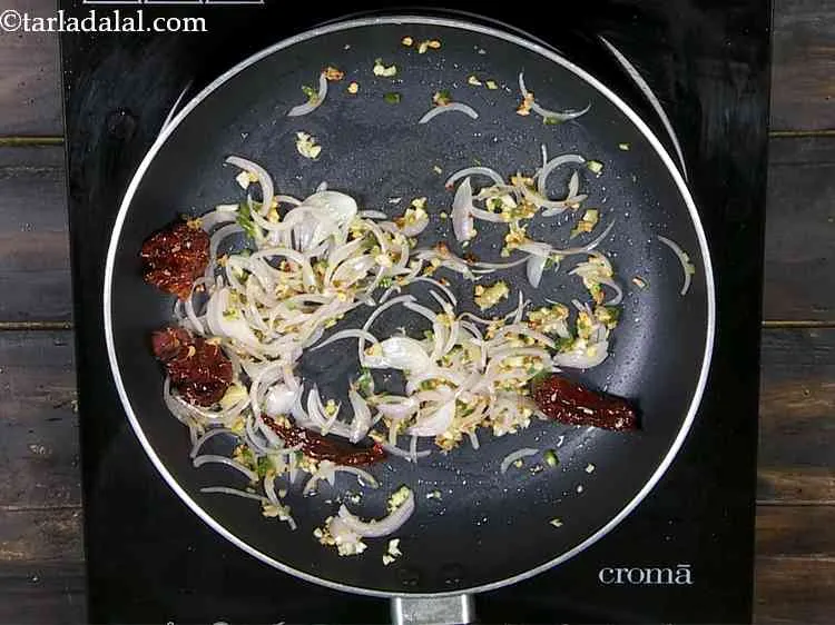 Step 13 – Now add ginger and green chillies and saut? on a medium flame for 1 minute. …