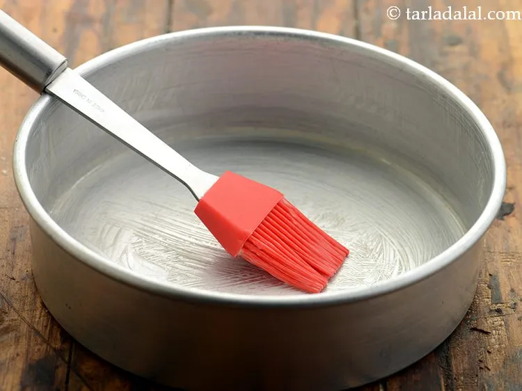 Step 14 – Grease a 175mm. (7&rdquo;) diameter cake tin with little melted butter.