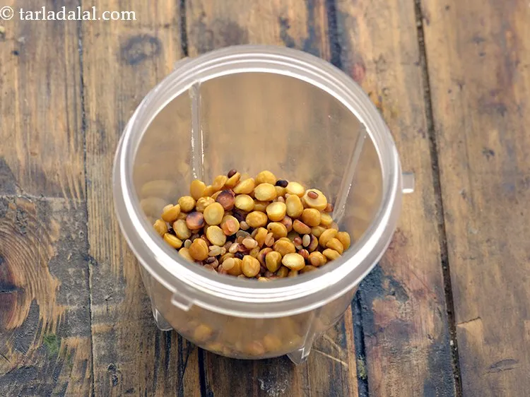 Step 7 – When cool, transfer the dals to a small mixer jar.