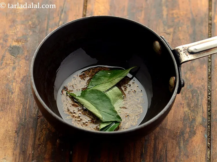 Step 16 – Add curry leaves. Curry leaves also help in enhancing the taste of the raita.