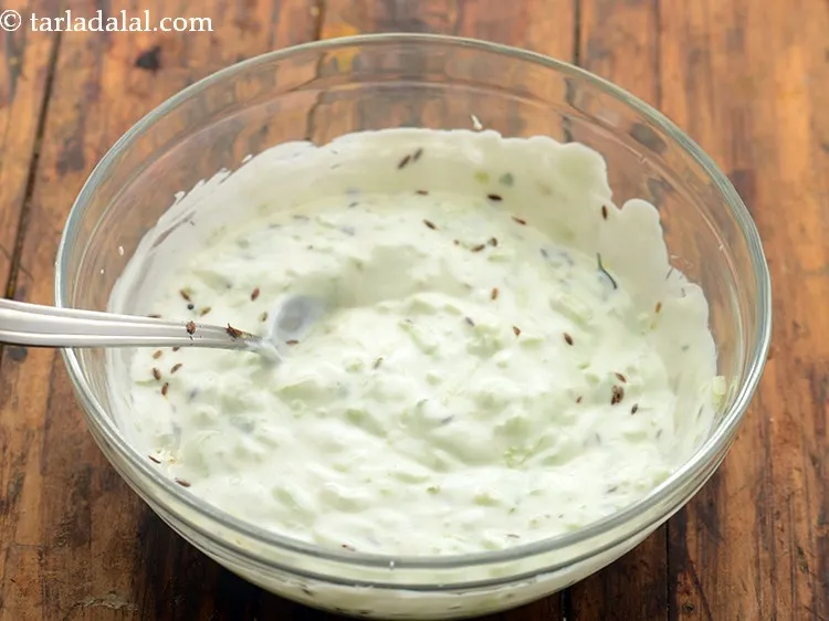 Step 19 – Mix<strong> healthy cucumber raita</strong> well and our low calorie cucumber raita is ready!