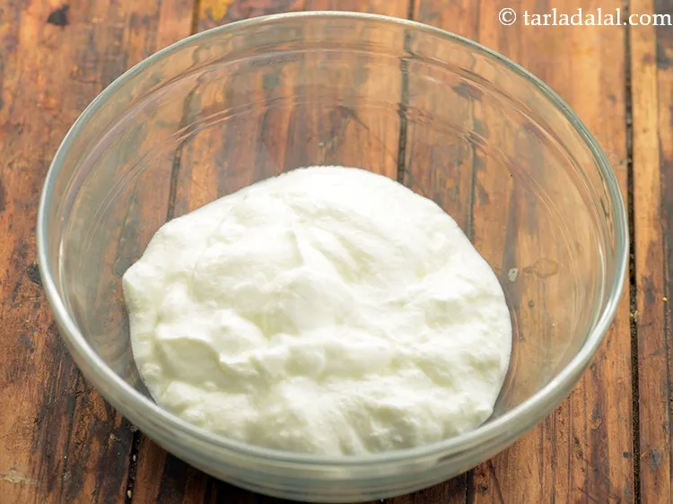 Step 8 – Further, in a deep bowl, take curd. We have used homemade curd, you can get …