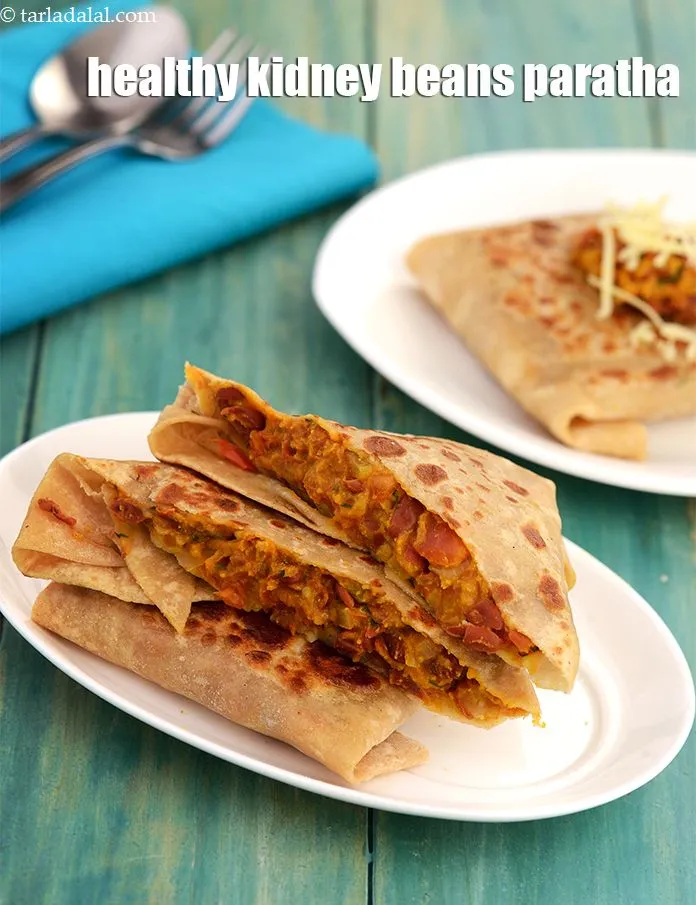 Step 55 – <meta charset="UTF-8" /> Cut each paratha diagonally across.&nbsp;Serve&nbsp;<strong>rajma paratha | stuffed rajma paratha | healthy …