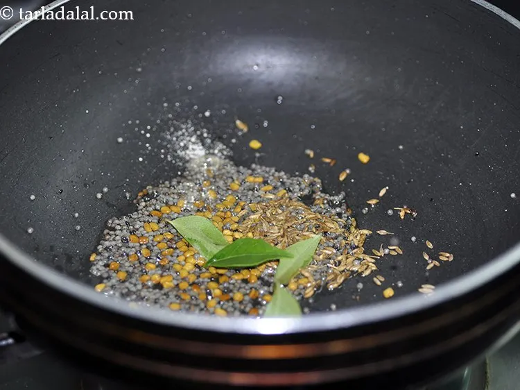 Step 25 – Add curry leaves.
