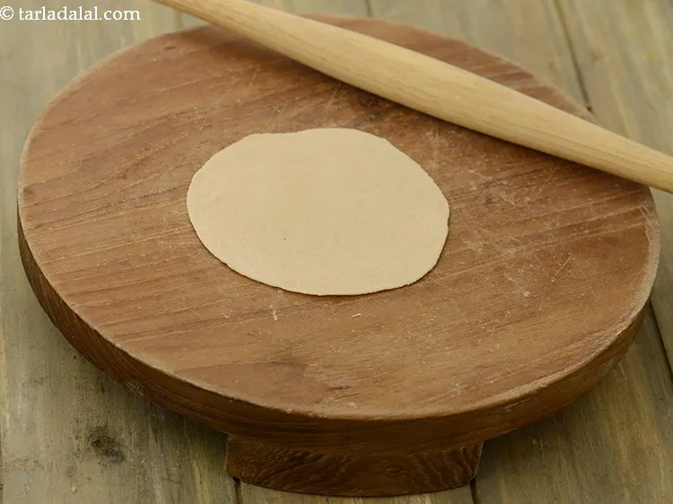 Step 13 – <p>Roll out a portion of the dough into a 75 mm. (3") diameter circle using …