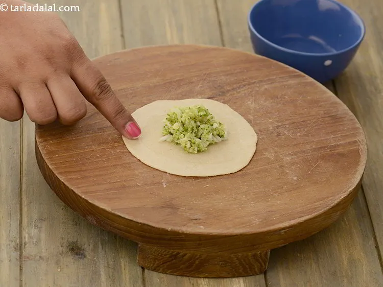 Step 15 – <p>Take little water and apply it using your finger on the circumference.</p>