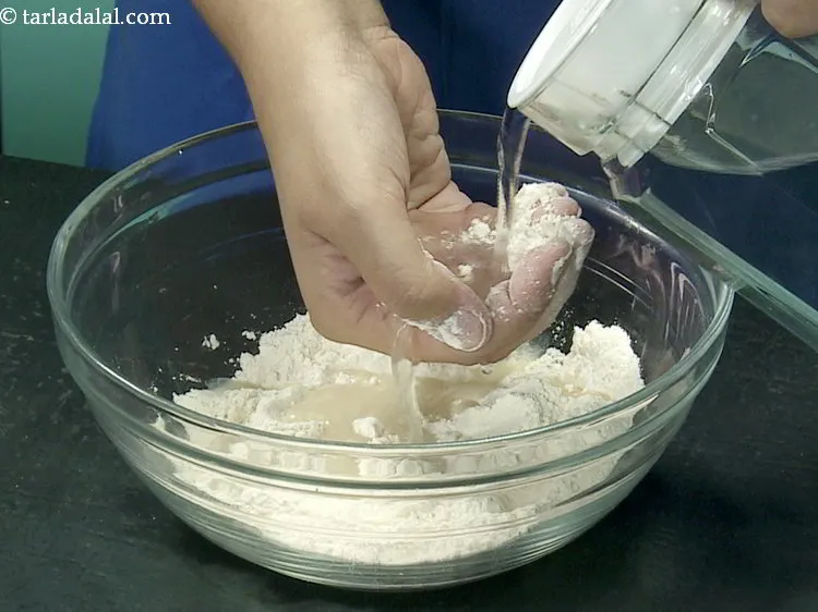 Step 4 – <p>Mix well and gradually add water.</p>