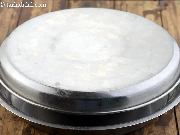 Step 20 – Transfer the mixture into a deep bowl, cover it with a lid and keep aside …