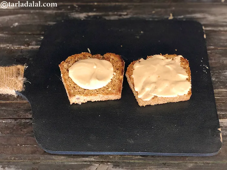 Step 6 – Spread &frac34; tbsp of peanut butter over each toasted multigrain bread slice.&nbsp;Click here to&nbsp;<a href="https://www.tarladalal.com/Homemade-Peanut-Butter-for-Weight-Loss-and-Athletes-41116r"><strong>learn …